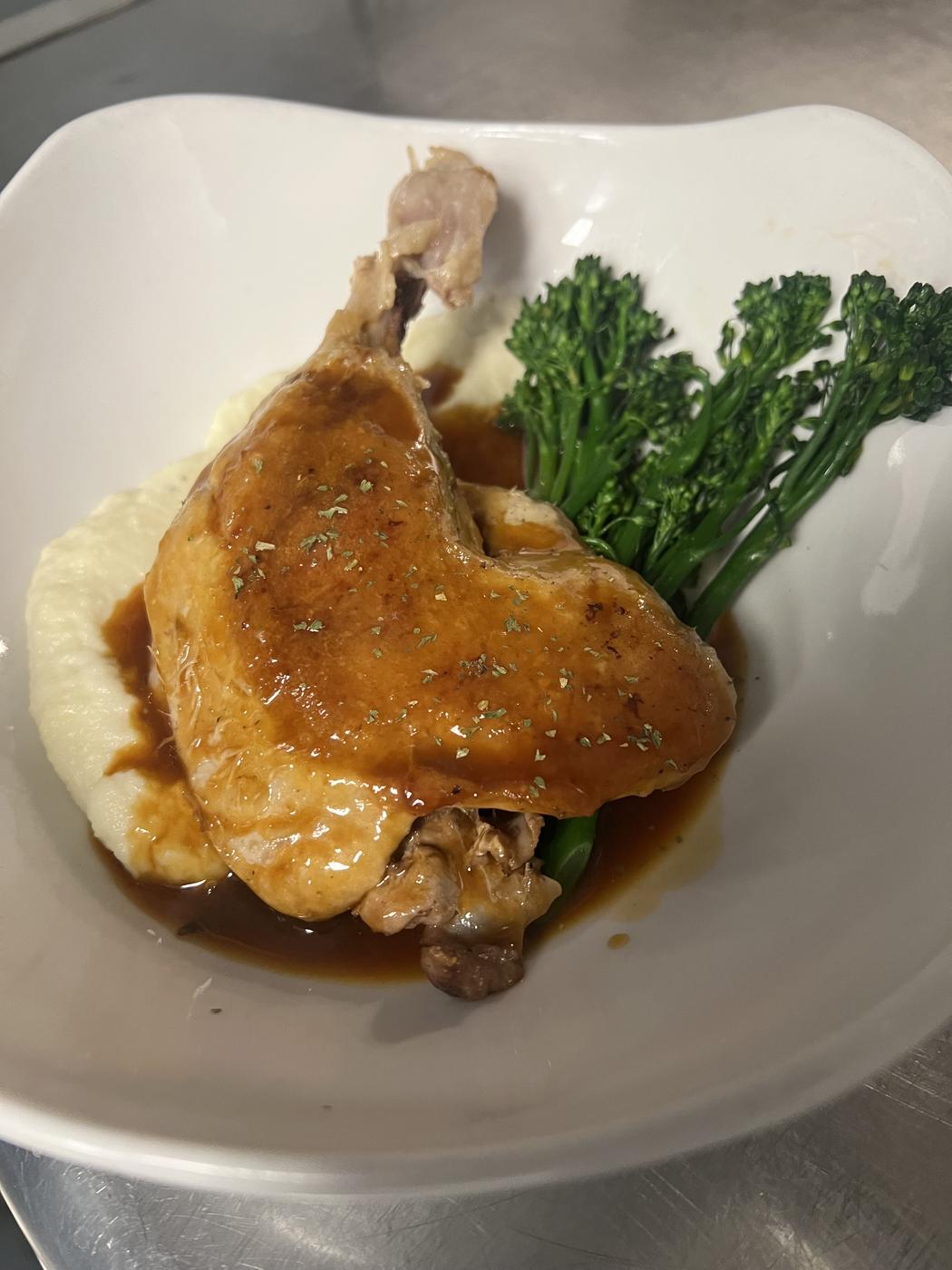 Braised leg with broccolini over mashed potatoes