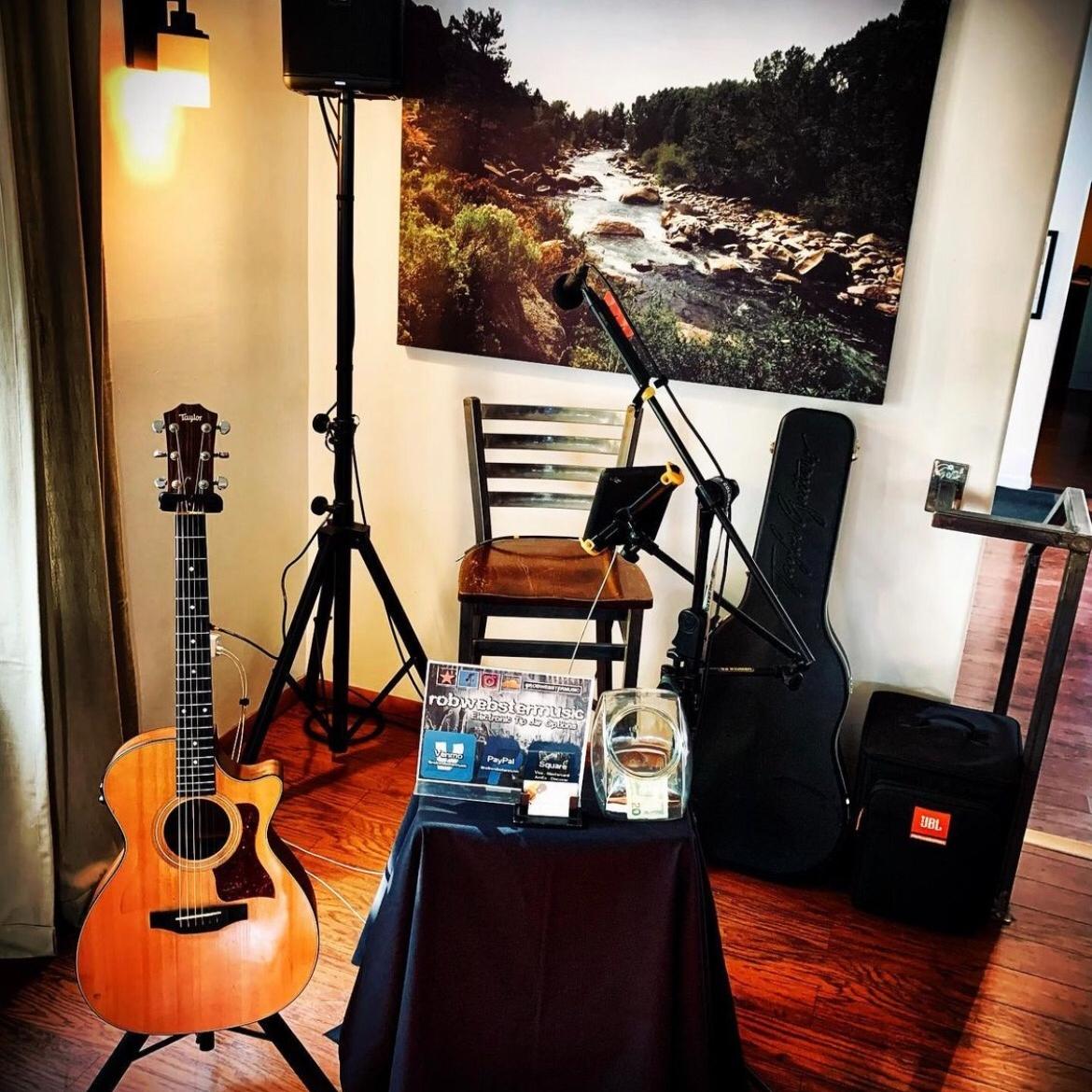 The Bistro's music corner with a guitar, microphone and speakers