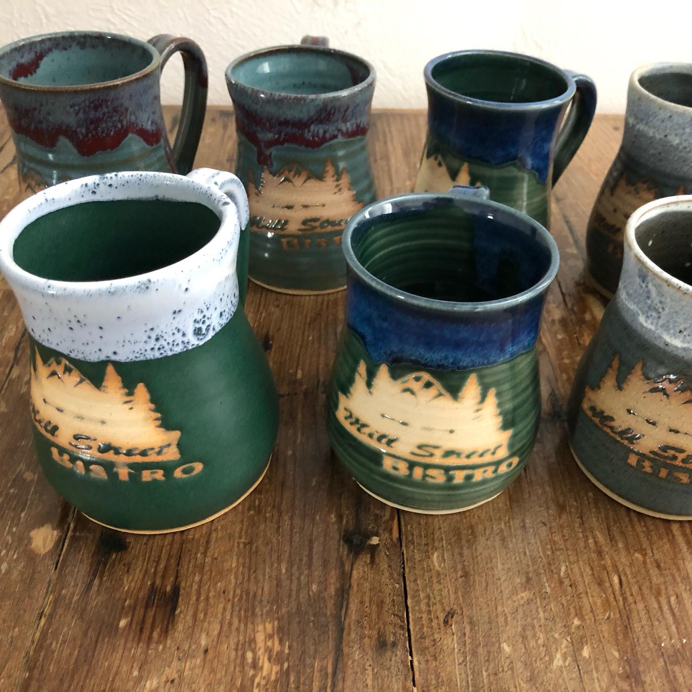 A row of stoneware Mill Street Bistro mugs