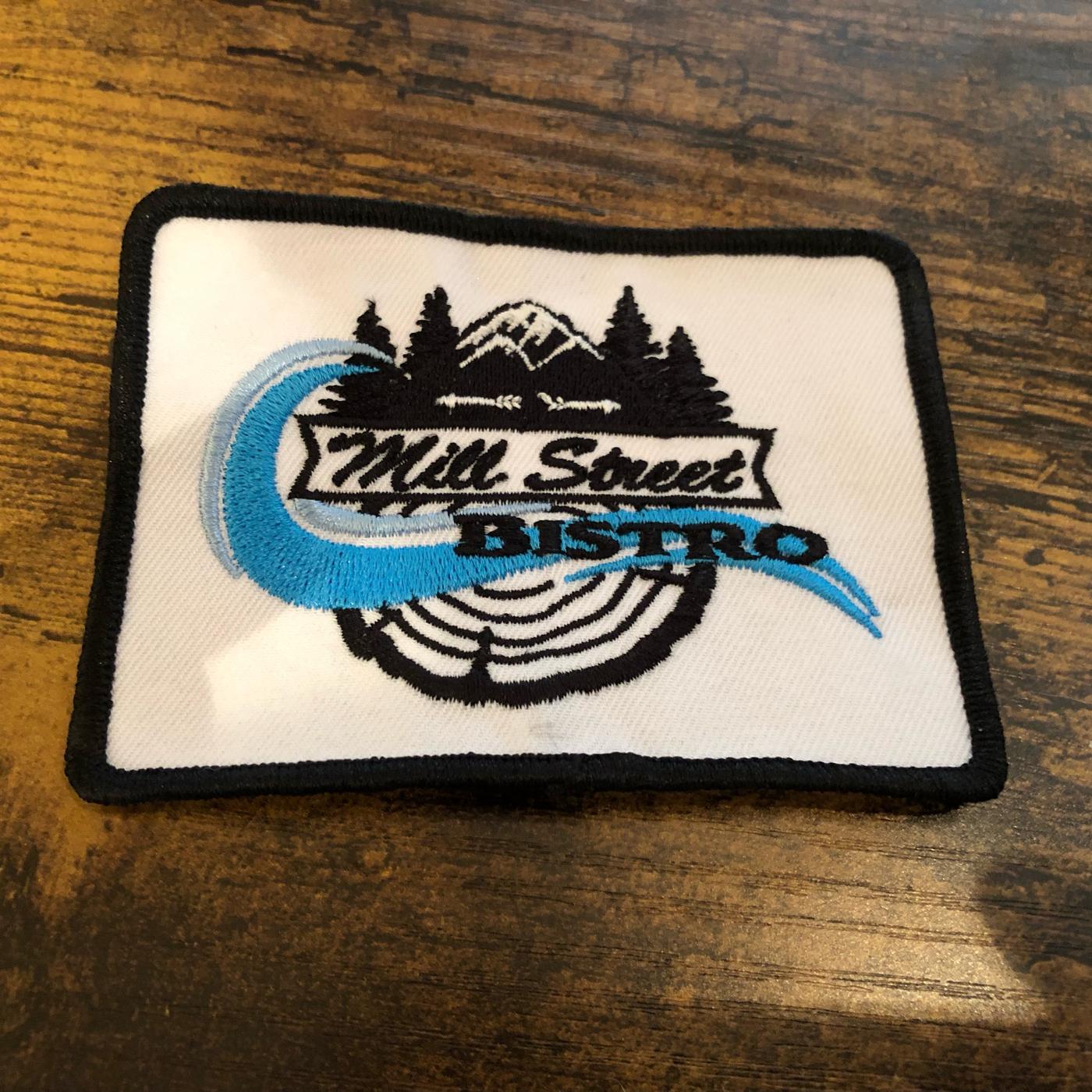 An embroidered Mill Street Bistro patch